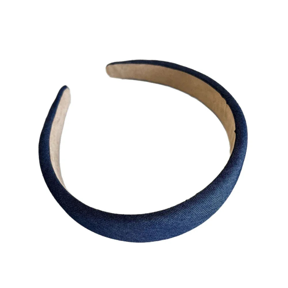 A single padded denim headband with a tan interior.