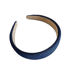 A single padded denim headband with a tan interior.