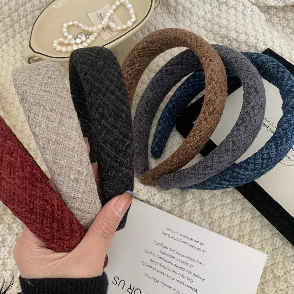 Collection of padded headbands in various colors including red, beige, black, brown, grey, and blue