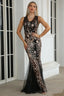 Woman wearing a black sleeveless mermaid gown with gold sequin embellishments and a sheer tulle hem.