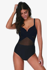 Woman wearing a black one-piece swimsuit with mesh detailing