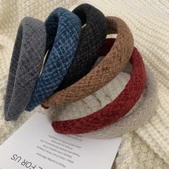 Close-up of various textured padded headbands, showcasing different colors and fabric detail
