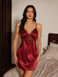 Front view of a woman wearing a red satin and lace slip dress