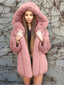 Woman wearing a pink faux fur hooded coat
