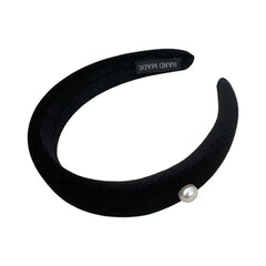 black padded headband with a single pearl accent