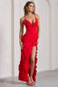 woman in a long red satin dress with ruffles and a high slit