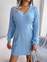woman in a light blue cable knit bodycon dress