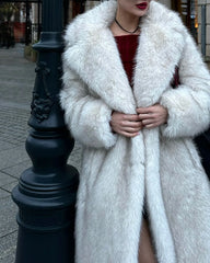 Close-up of a woman wearing a white faux fur coat