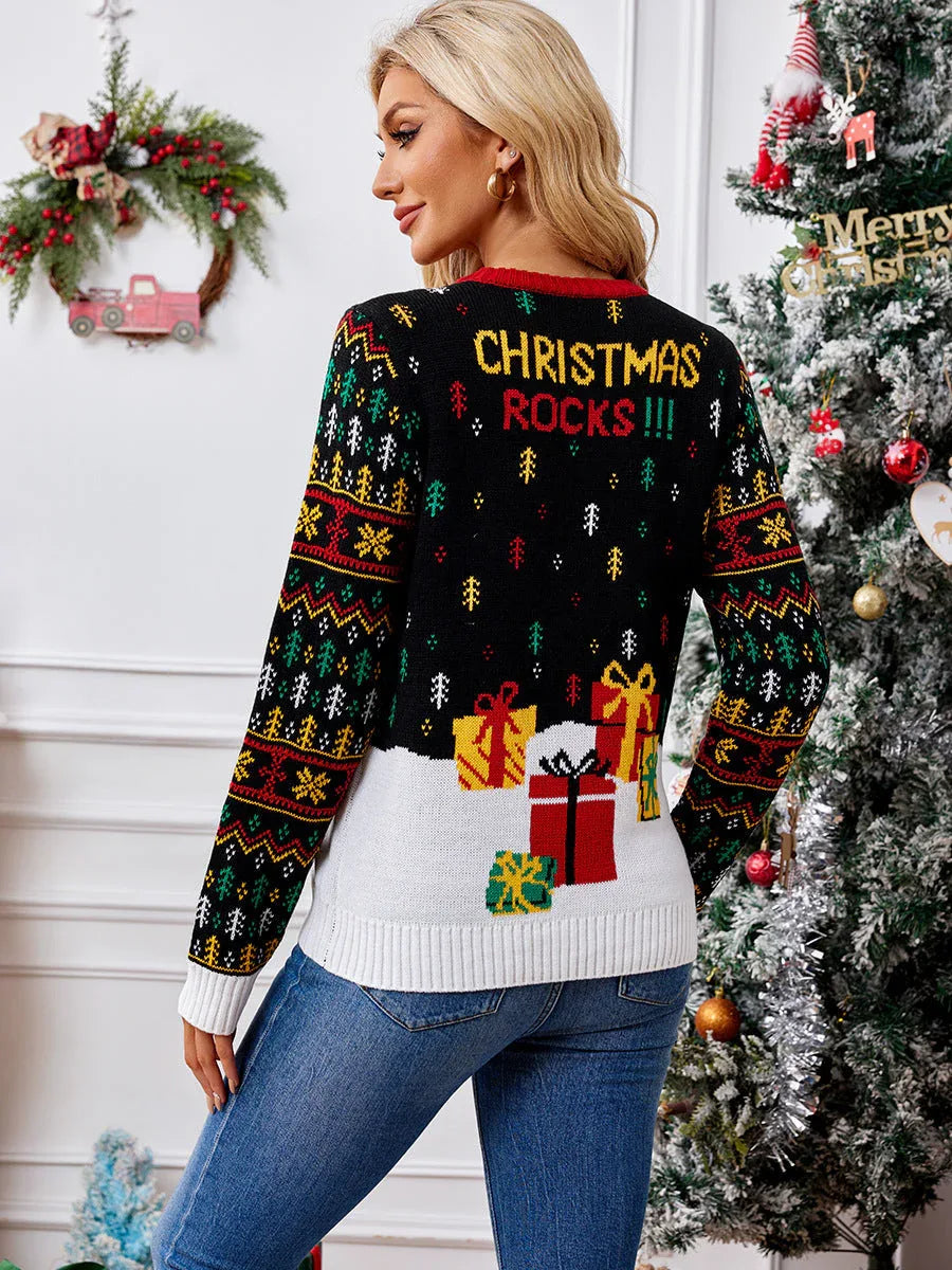 Back view of a woman wearing a black Christmas sweater with a graphic of presents and the text 'CHRISTMAS ROCKS!!!'.