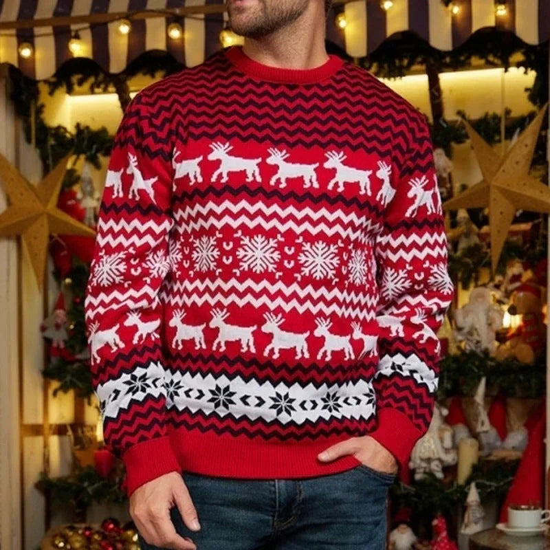 Man wearing a red and white Christmas sweater with a reindeer and snowflake pattern.