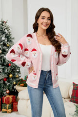 Woman wearing a pink Santa Claus print knit cardigan with blue jeans