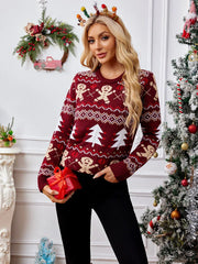 Woman holding a red gift box while wearing a festive red sweater with Christmas designs.