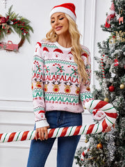 Rear view of a woman in a pink Christmas sweater featuring a knitted pattern of Santa Claus, reindeer, and candy canes