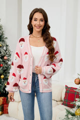 Close-up of a woman wearing a pink Santa Claus print knit cardigan