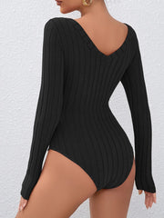 Back view of a black ribbed long-sleeve bodysuit with a deep V-back.