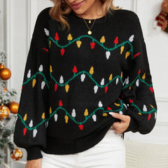Close-up of a woman wearing a black knitted sweater with a Christmas lights pattern