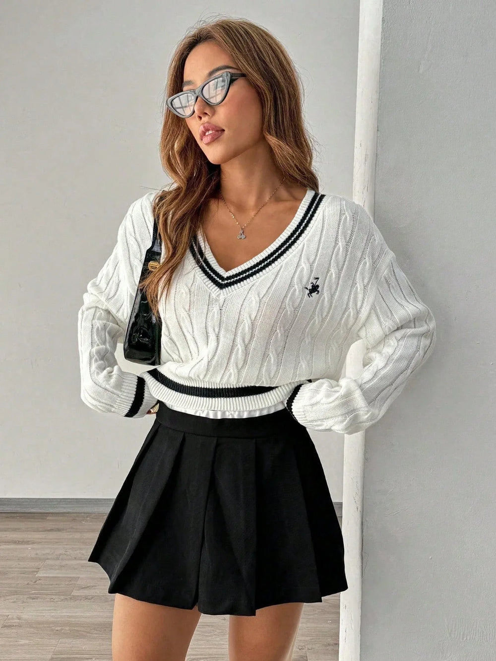 White cable knit V-neck sweater with black trim and embroidered crest - View 6 | TEVQA