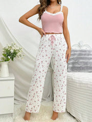 woman posing in pink floral pajama set