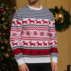 Man wearing a white and red Christmas sweater with a reindeer and snowflake pattern.