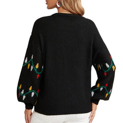 Back view of a woman wearing a black knitted sweater with a Christmas lights pattern