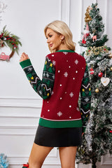Back view of a woman wearing a Christmas sweater with snowflake and geometric patterns.