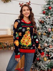 Woman wearing a black Christmas sweater with a pizza tree graphic and the text "All I want for Christmas is food"