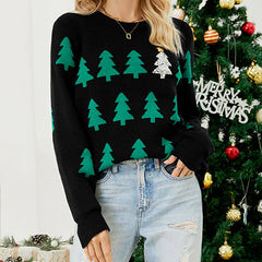 Close-up of a woman wearing a black Christmas sweater with green trees and a sequined tree.