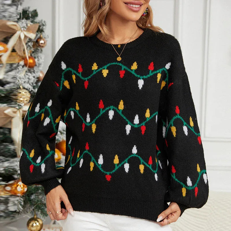 Front view of a woman wearing a black knitted sweater with a Christmas lights pattern