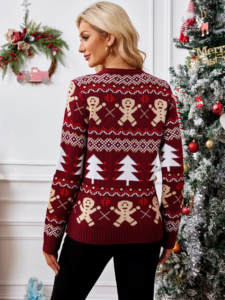 Back view of a woman in a red holiday sweater featuring gingerbread men and trees.