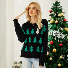 Woman wearing a black Christmas sweater with green trees and a sequined tree.