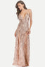 Woman wearing a rose gold sequined evening gown with a plunging neckline and high leg slits.