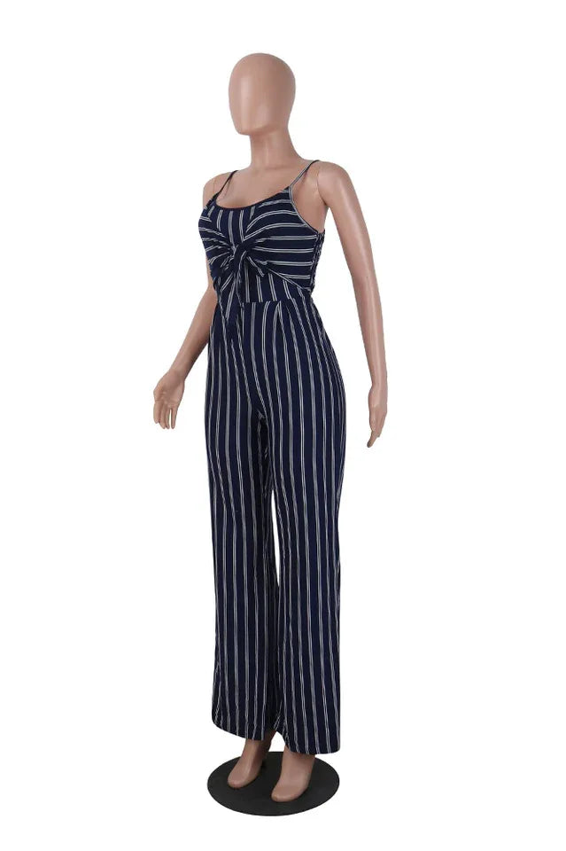 Mannequin wearing a navy and white striped jumpsuit with a tie-front detail and wide legs, side view.