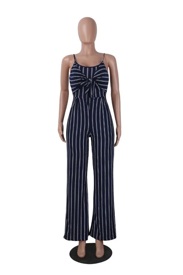 Mannequin wearing a navy and white striped jumpsuit with a tie-front detail and wide legs, front view.