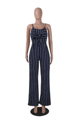 Mannequin wearing a navy and white striped jumpsuit with a tie-front detail and wide legs, front view.