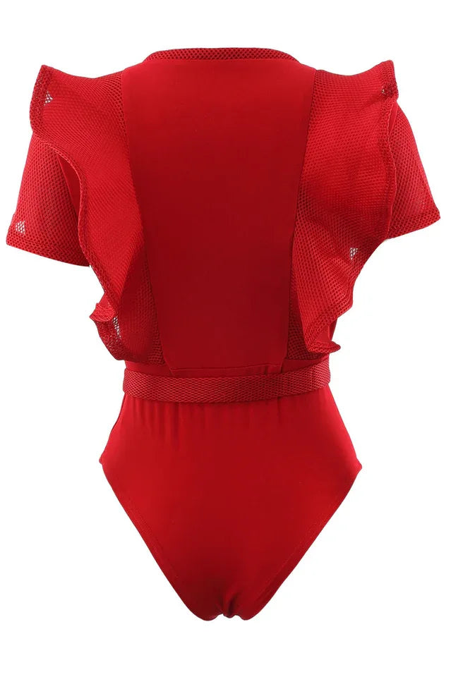 Red ruffled bodysuit with sheer mesh panels and a belted waist, back view.
