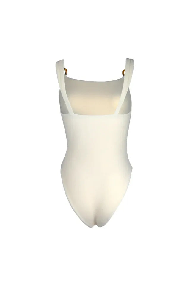 Cream-colored one-piece swimsuit with cut-out details and ring accents, back view.