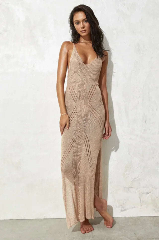 Woman wearing a beige knit maxi dress with spaghetti straps and a V-neckline.