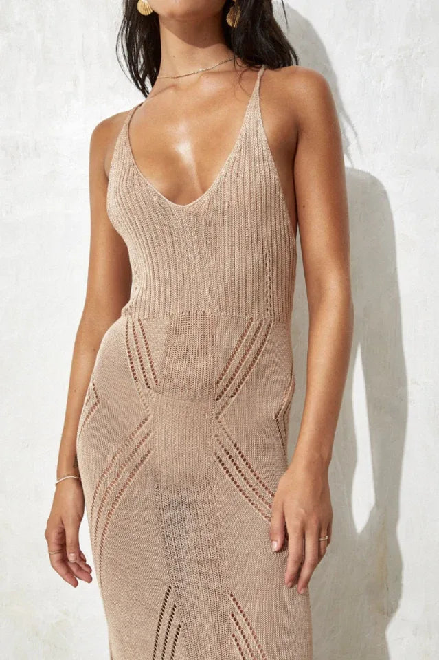 Close-up of the V-neckline and knit pattern of a beige maxi dress.
