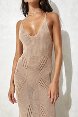 Close-up of the V-neckline and knit pattern of a beige maxi dress.