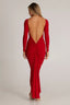 woman wearing a red long-sleeved maxi dress with a low back