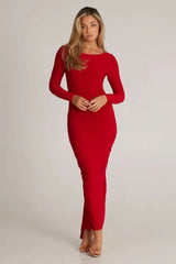 full body shot of a woman in a red maxi dress
