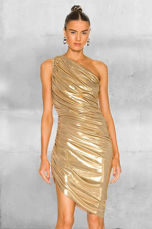 Woman wearing a gold one-shoulder ruched dress with an asymmetrical hemline, front view.