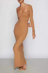 Woman wearing a long-sleeved, ribbed knit, square-neck, brown maxi dress, front view.