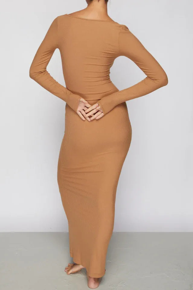 Woman wearing a long-sleeved, ribbed knit, square-neck, brown maxi dress, back view.