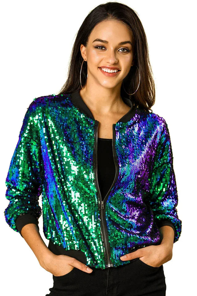 Close-up front view of a woman smiling, wearing a colorful sequined bomber jacket.