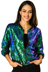 Close-up front view of a woman smiling, wearing a colorful sequined bomber jacket.