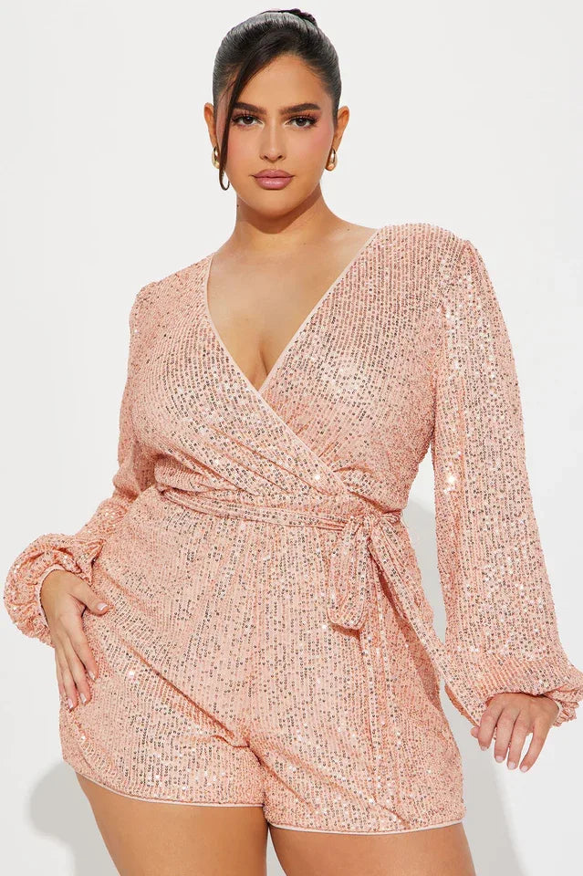 close-up of a woman wearing a pink sequin romper