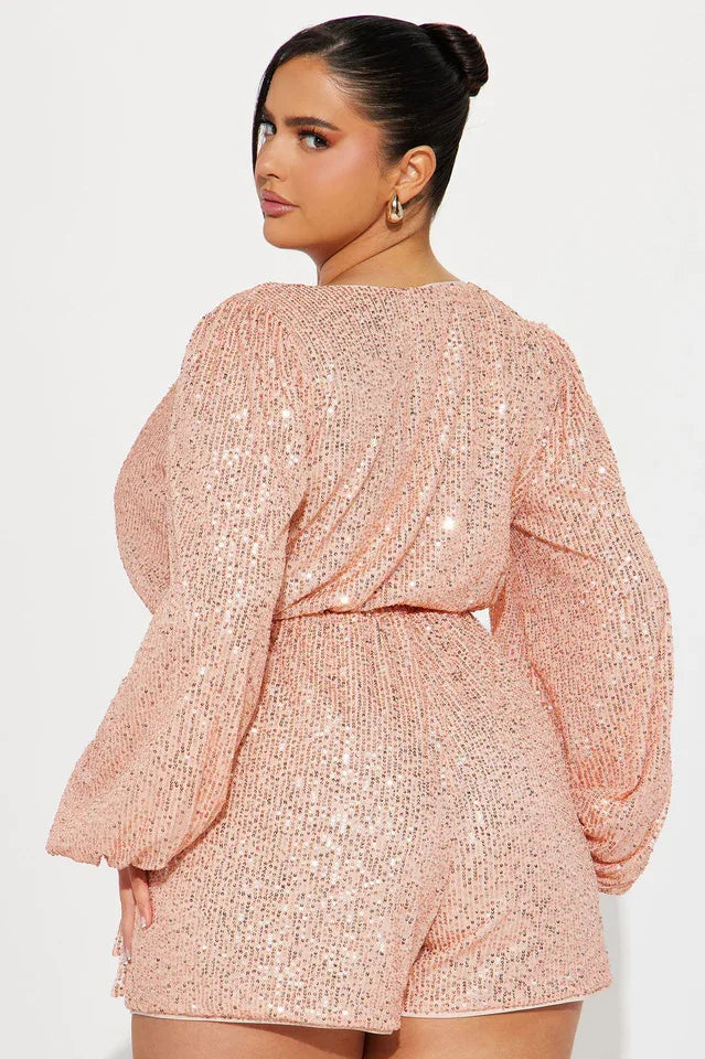 rear view close-up of a woman in a pink sequin romper