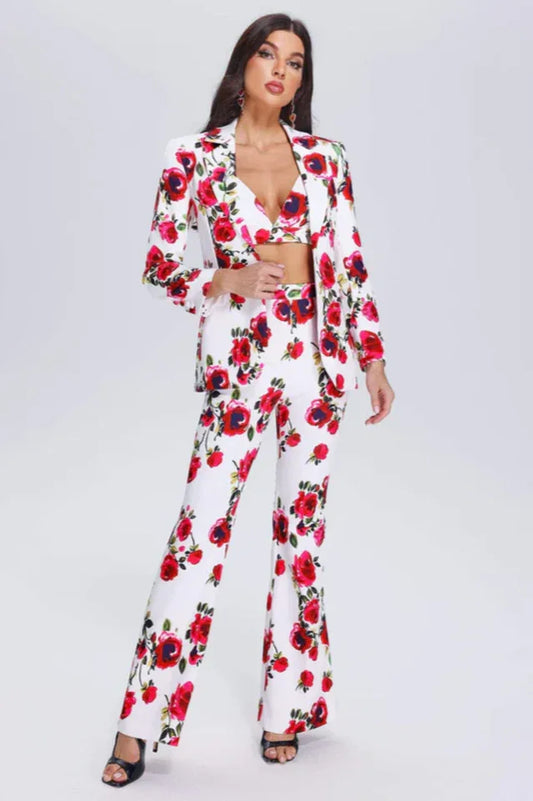 Woman wearing a white floral print suit with a matching bralette