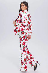 Back view of a woman in a white floral print suit with flared pants